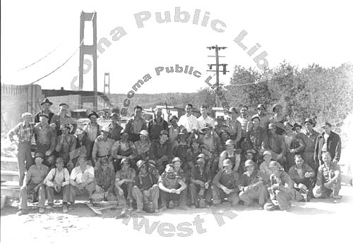 Construction workers gather for portrait with 1940 bridge in background, June 28, 1940 TPL 6206
