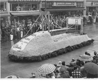 Flower-covered Narrows Bridge on float in the Daffodil Festival parade in Tacoma, April 1950 TPL 19428