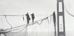 Salvage, two fearless workmen walk the damaged cable, 1943 WSA, WSDOT records