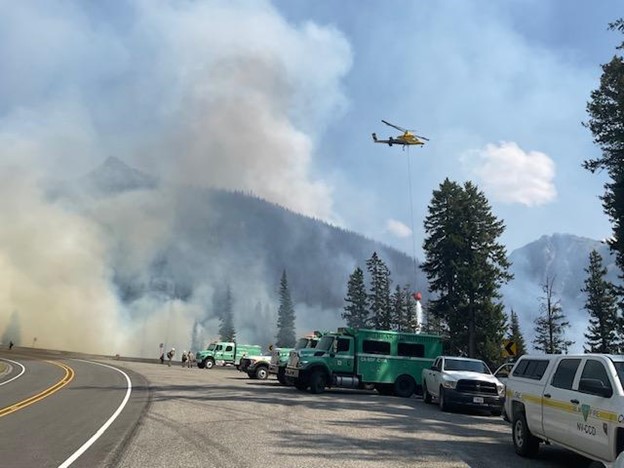 Fire crews and N39HX (helicopter staged out of Methow Valley State Airport) work to suppress the Blue Lake Fire image