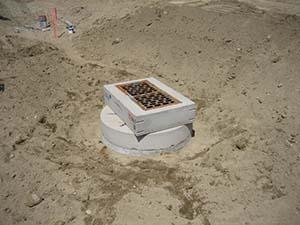 Grate inlet on catch basin surrounded by dirt - DS-2
