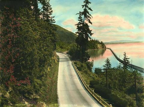 View of Chuckanut Drive and the railroad trestle crossing the bay, looking south. 1926.