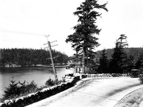 View of water body looking from road at Inspiration Point on Chuckanut Drive , ca. 1920