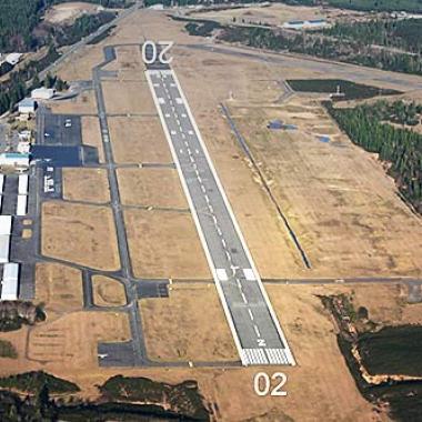 The Bremerton runway is a clear area surrounded by grass.