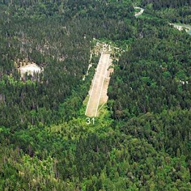 Stehekin Airport Runway nestled in the forest.