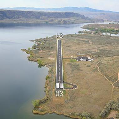 The runway at Grand Coulee Dam airport, situated next to the water. 