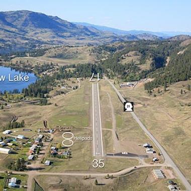 Ferry County airport runway located in a flat area with a body of water nearby.