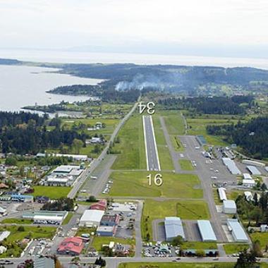 Friday Harbor Airport runway located near the city center and water. 