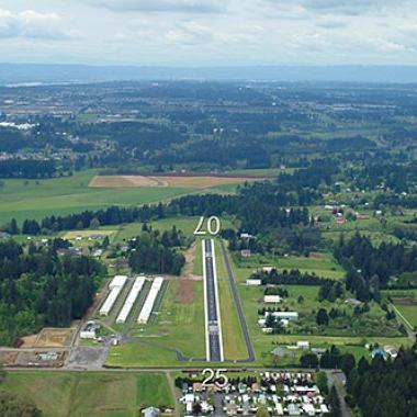 Grove Field Runway airport nestled inbetween grasslands and trees.