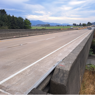 Completed work on I-5 Samish River Bridge with new polyester deck overlay.