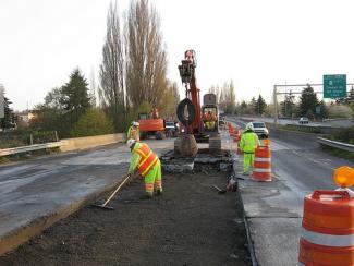 road construction workers working