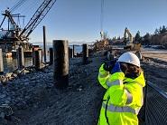 Photo of person monitoring for protected species near a terminal construction site