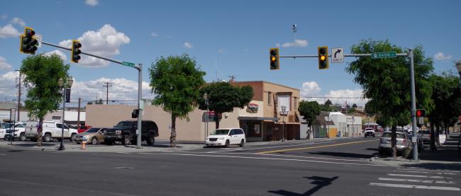 Image of an intersection with a traffic signal.
