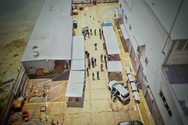 View from drone of several tents set up at Eagle Harbor Maintenance Facility