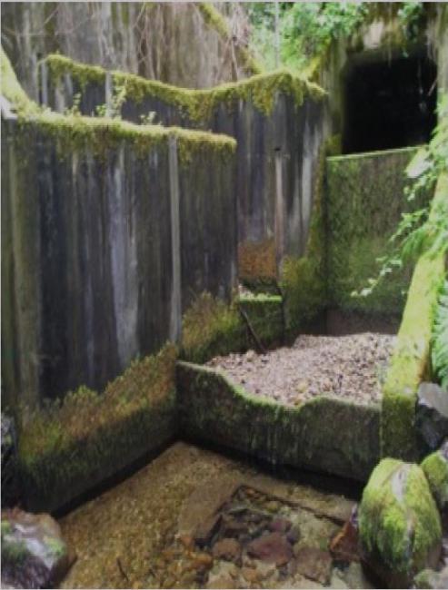 A photo showing the existing Evans Creek culvert with fishway areas that are too shallow and too high for fish to navigate, posing a barrier to fish.