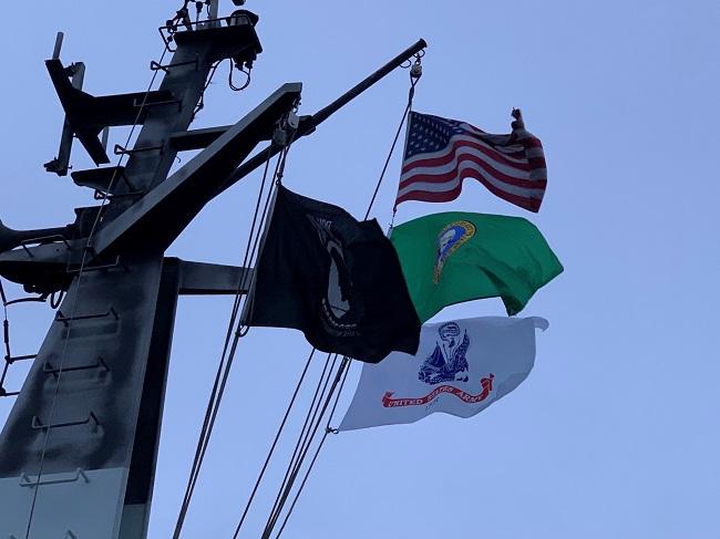 American, Washington state, POW/MIA and U.S. Army flag flying atop a ferry