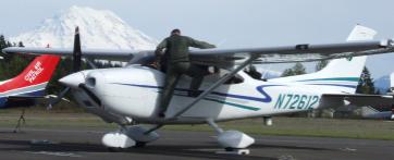 A small plane in an air field